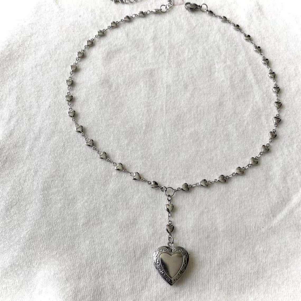قلادة سلسلة الوهق المسبحة مع ق - مراجعة Heart Locket Necklace Photo وسعره